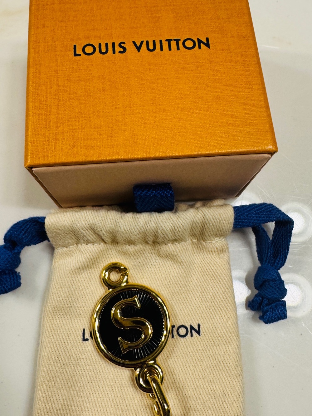Louis Vuitton Gold and Black S Charm